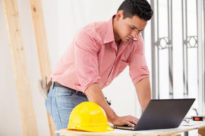 Builder Using Laptop Onsite
